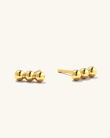 Gold Triple Dot earring studs.