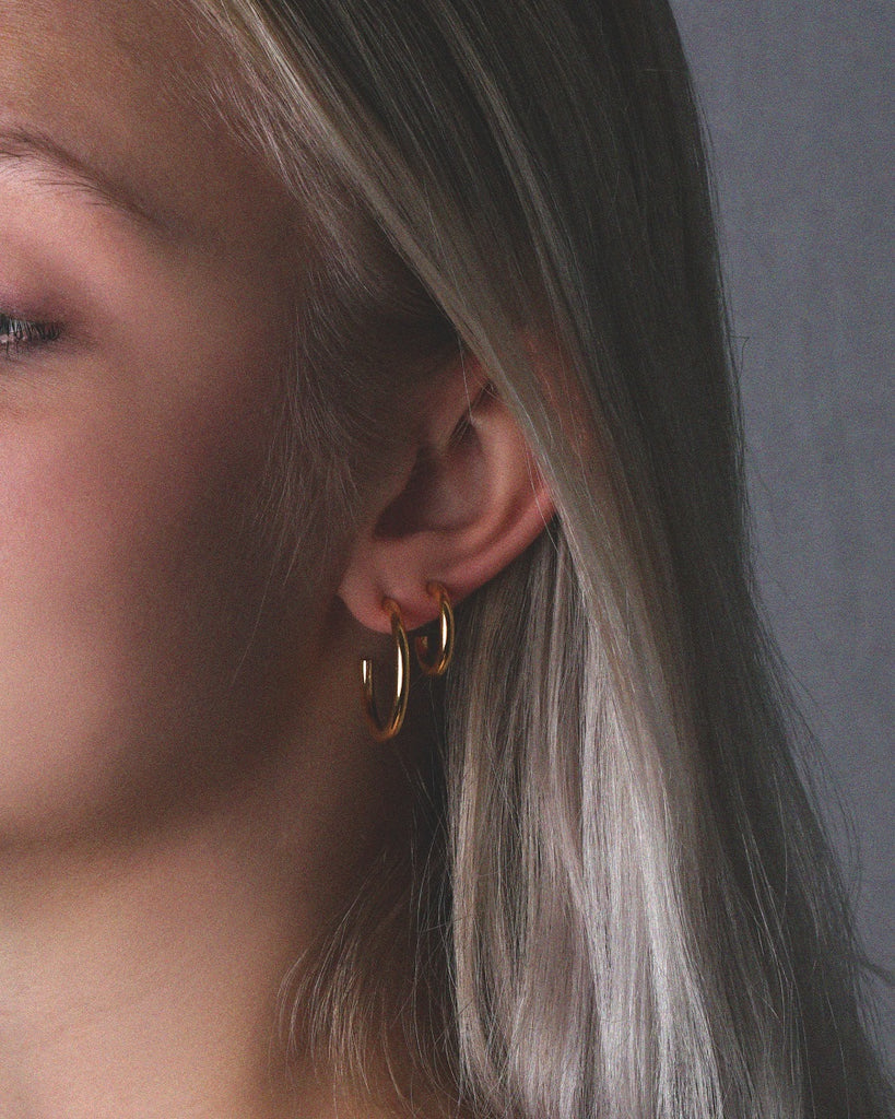 Classic gold vermeil medium and small stacked Pepa hoop earrings.